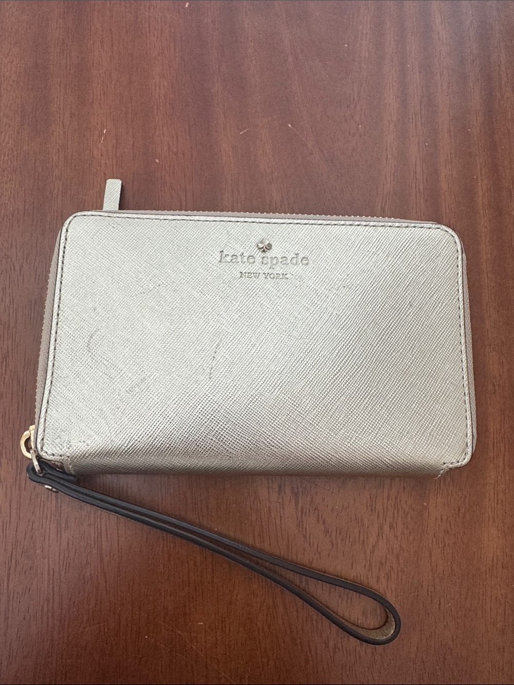 kate spade metallic champagne gold zip-around wristlet